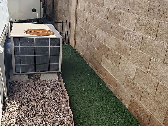 Dog turf next to back wall
