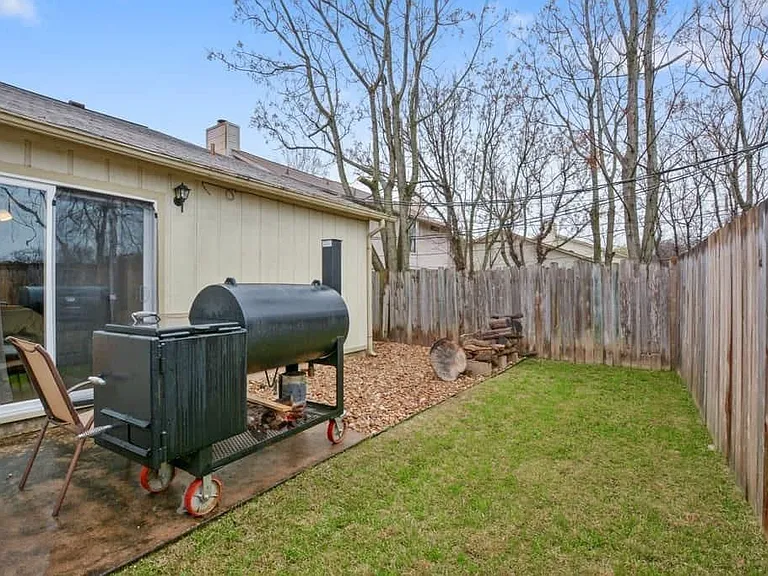 Grill not included. House is painted grey now.
