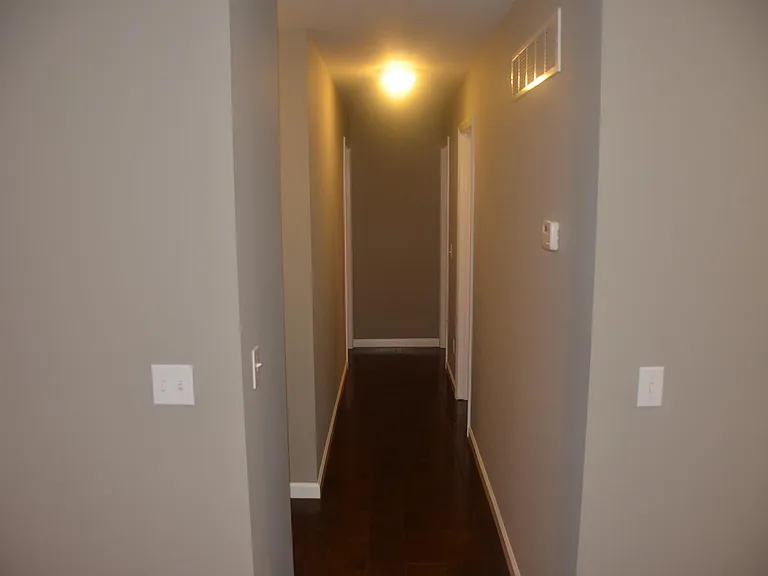 hallway to 3 bedrooms and full bathroom