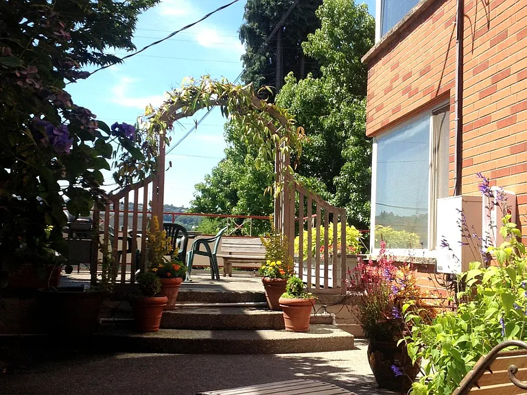 2 tiered peaceful very large building shared patio , gas BBQ , seating , mature garden
