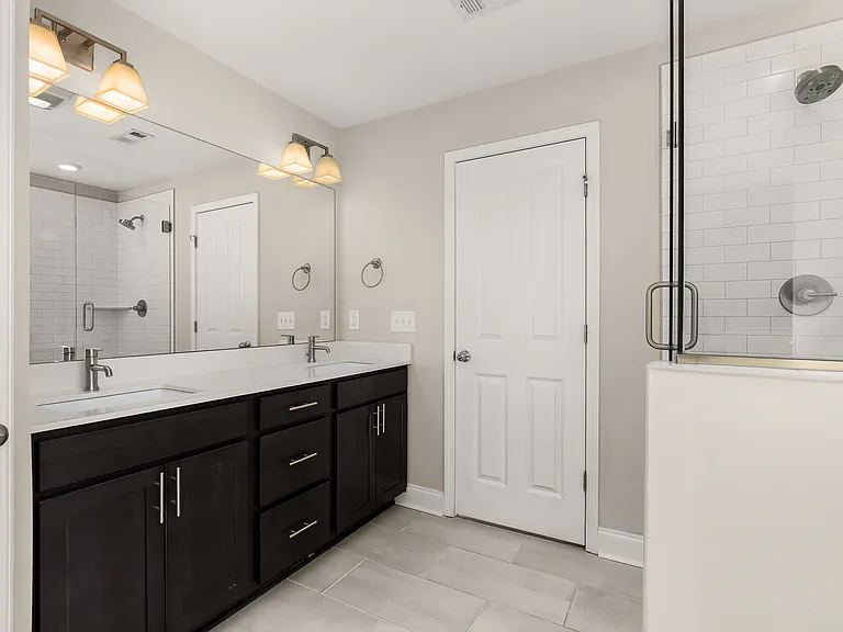 Walk in glass shower and tile floors for the primary bath
