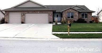 Front of home : Professionally landscaped with sprinkler system