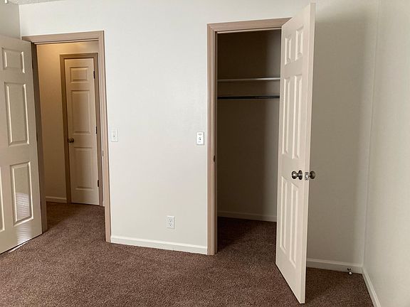 Master bedroom with walk-in closet and half bath.