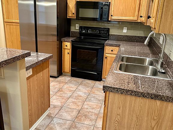 Kitchen, refrigerator, stove, microwave, dishwasher, double stainless steel sink