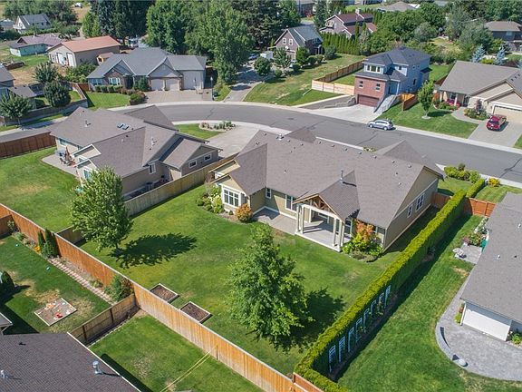 This beautiful home sits on the largest lot in Canterbury Estates, allowing plenty of room for outdoor living. Two large mature trees can be seen in the fenced back yard, along with some raised garden beds.