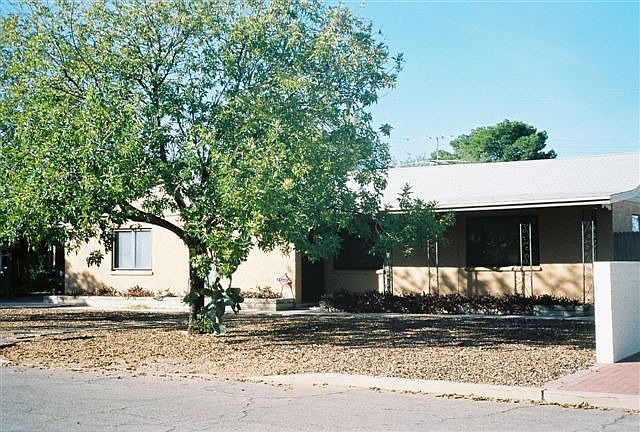 Masonry/Stucco Construction, easy care yard front & back, shady trees