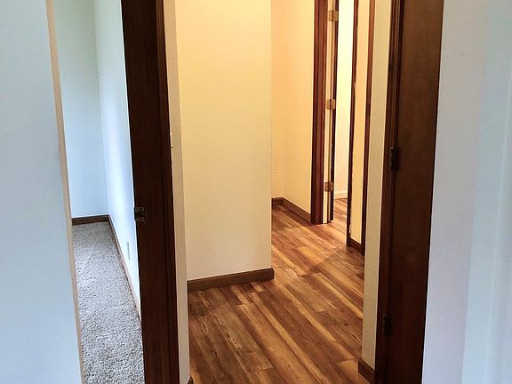 Downstairs hallway into bedroom, laundry area, bathroom and garage