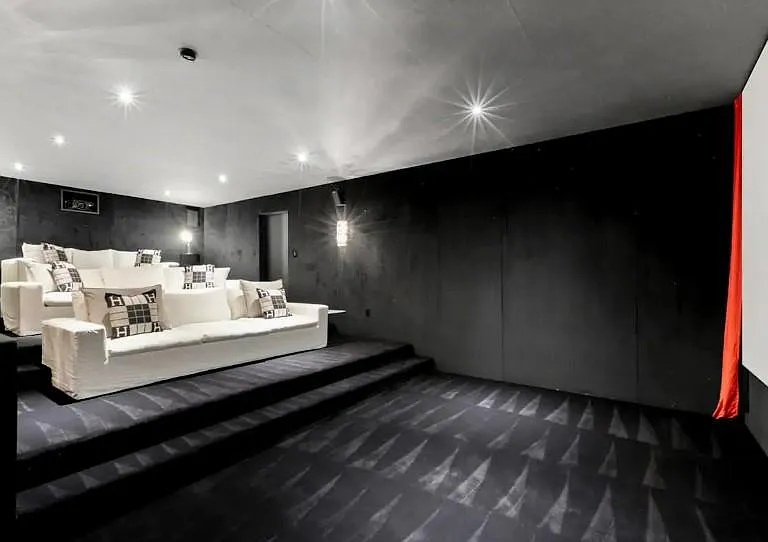Get comfortable in the Theater room's cosy space, for the perfect movie night.