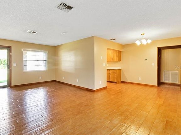 Living area, dining area and kitchen off front entry