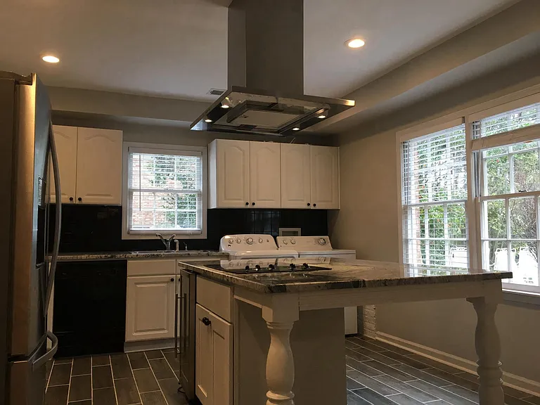 In-law suite kitchen with washer and dryer