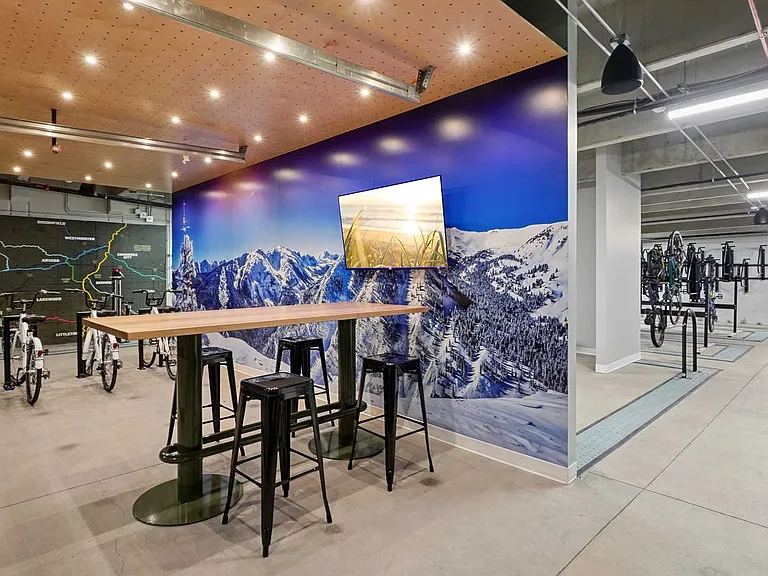 Secure bike storage, repair stations, and gathering spaces support an active lifestyle built around Colorado adventure and everyday convenience.