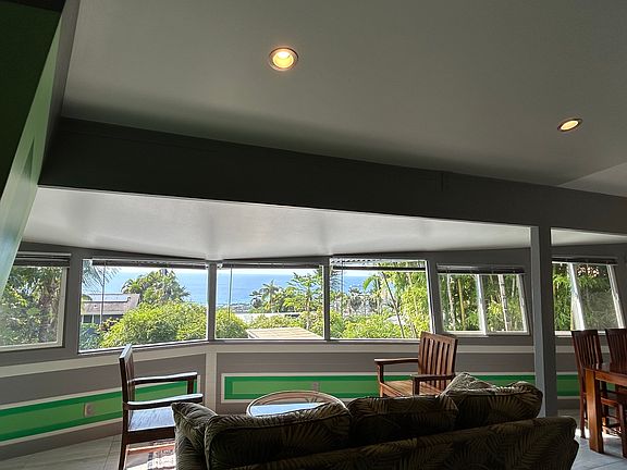 Back lanai sitting area, dining on the right