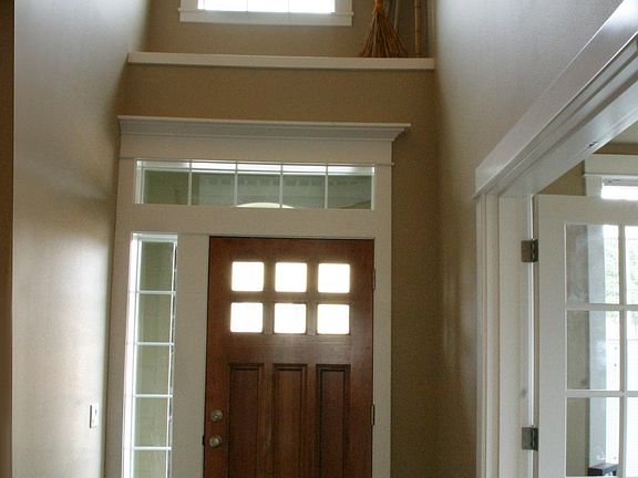 Looking at front door, office entry is via French glass door on the right