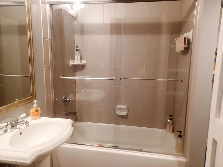 Bathroom With A Large Amount of Custom Shelving