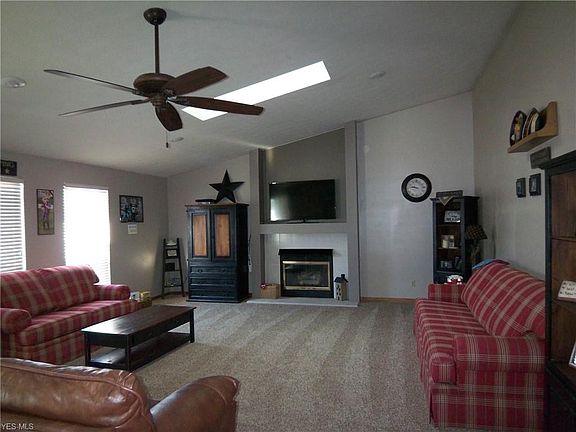 Great Room is 32 x 20 with 2 sky lights, gas fireplace and newer carpeting.  Dining area with hardwood floors are at the other end.