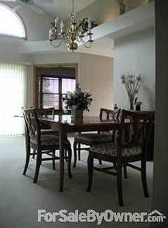 Dining Room
						:
						View to den and patio doors to deck- 12x12, vaulted ceiling, freshly painted