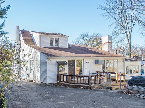 Backyard offers patio and deck areas for both apartments