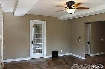 Living room with door to dining/den