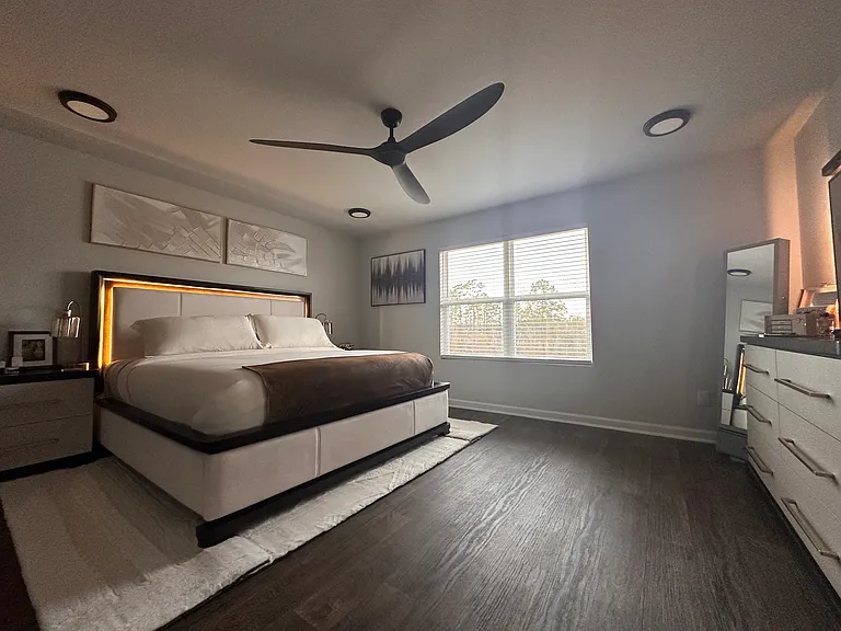 Master bedroom with beautiful pond and tree views.