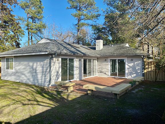 The large sliding glass doors provide plenty of light and access to the brick patio.