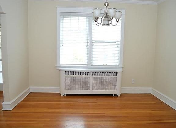 Hardwoods continue into the formal dining room