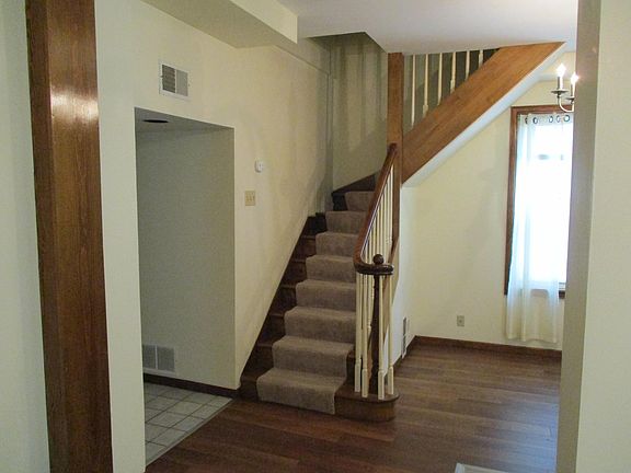 Stairway leading to upstairs bedroom