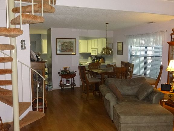 dining area with kitchen in back