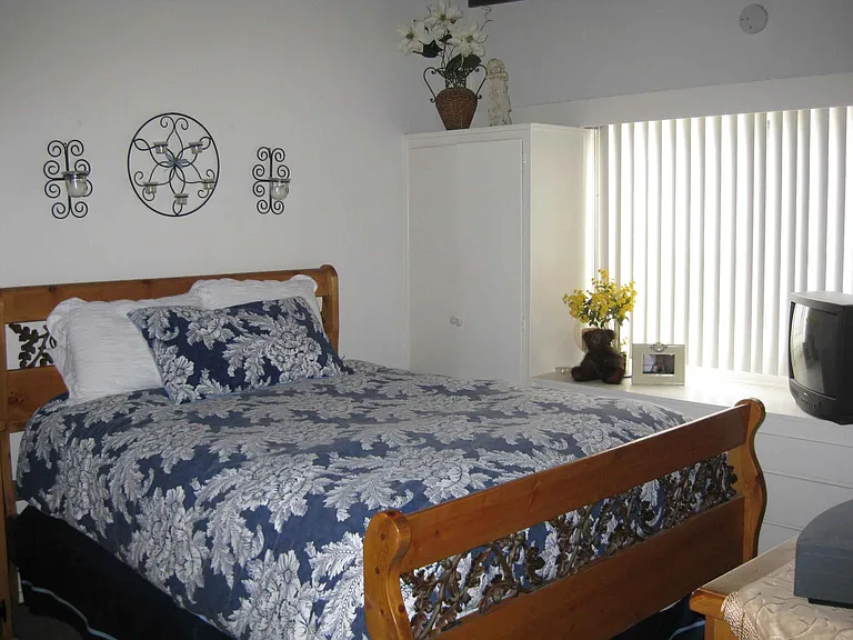 Archival photo of the bedroom.