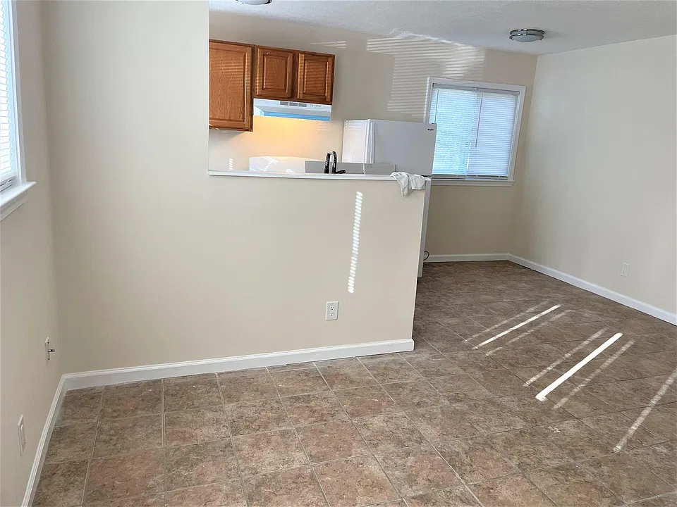 Spacious living room with kitchen