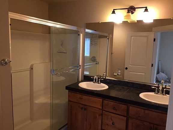 Dual vanity and huge shower in master bath.