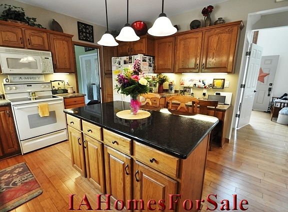 Updated pendent lighting above the island and bamboo hardwood flooring throughout entry, 1/2 bath, kitchen, eat-in dining area and office/formal dining room. 