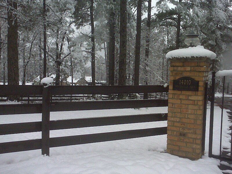 gate post, fence in winter
