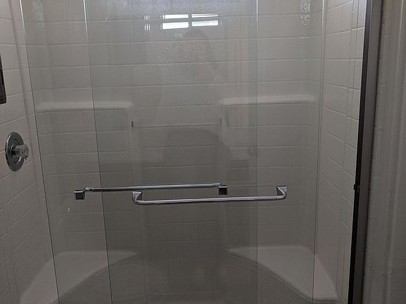 Glass shower doors in master shower.