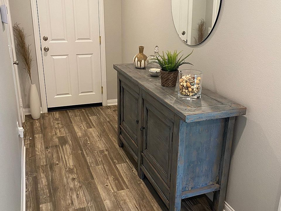 Front Hallway Door entrance carrying foot traffic to garage, closet on the left under stairs for coats and storage. To the right is the office with bathtub and bathroom (can be used as a 4th bedroom, a gym, entertainment room, or office).