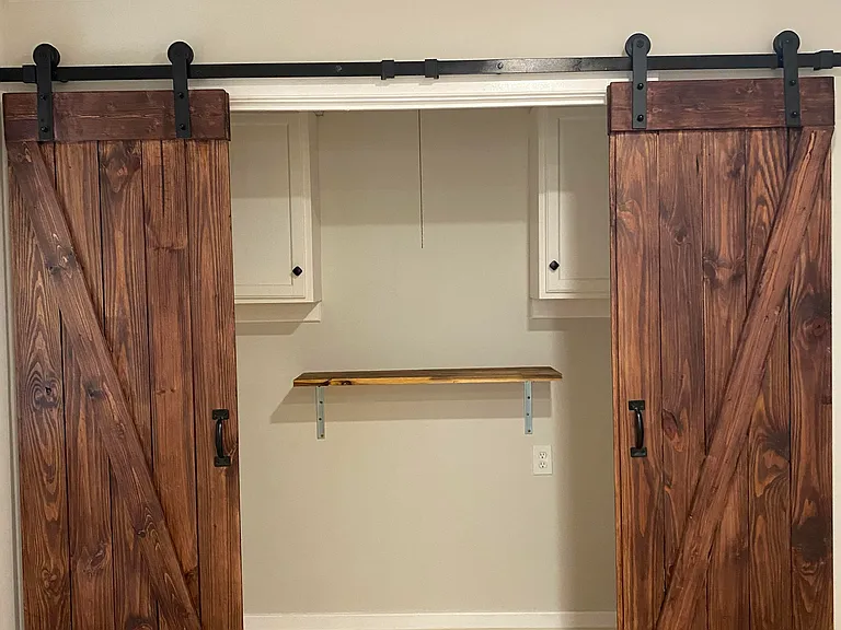 LAUNDRY ROOM WITH STORAGE. W/D NOT INCLUDED