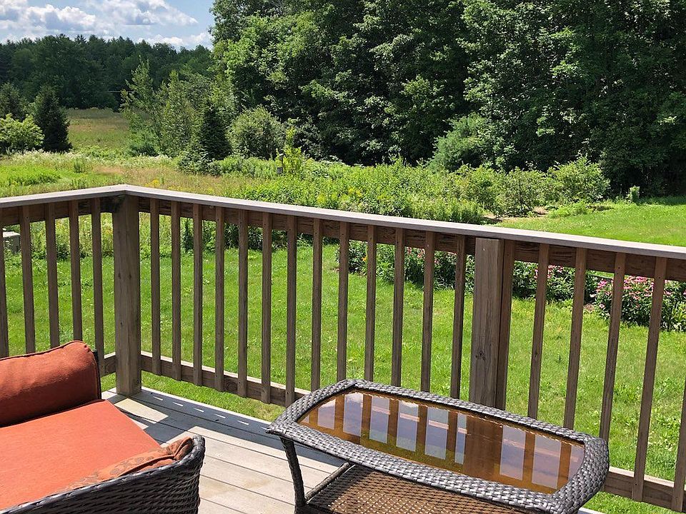 Private balcony overlooking lawns, trails, and blueberry bushes
