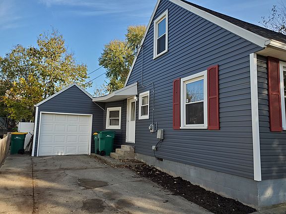 Side showing detached garage