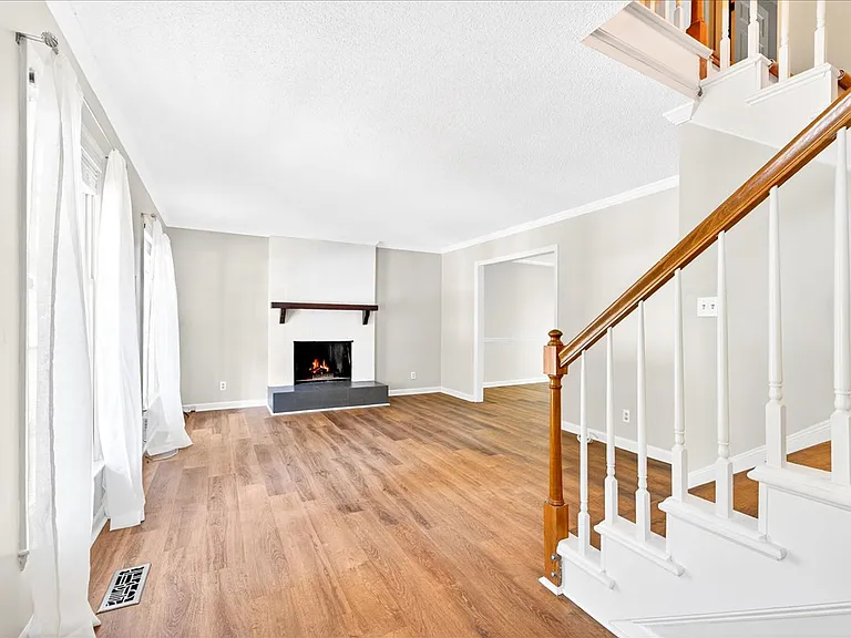 Living room with wood-burning fireplace makes for the coziest winters.