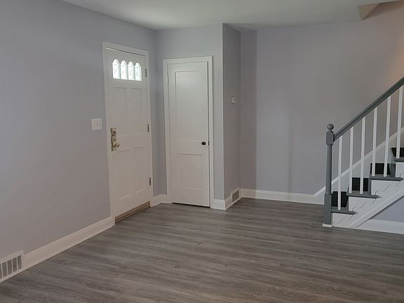 part of living room and stairs going to the second level