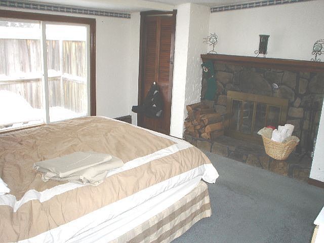 master bedroom with fireplace