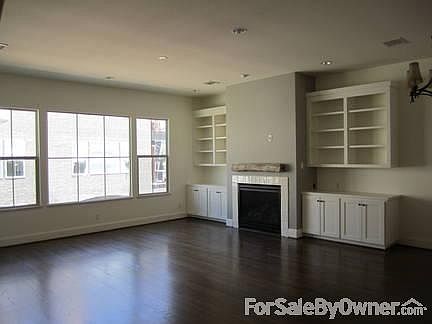 Beautiful built-ins. Lots of natural night in this open concept living space.