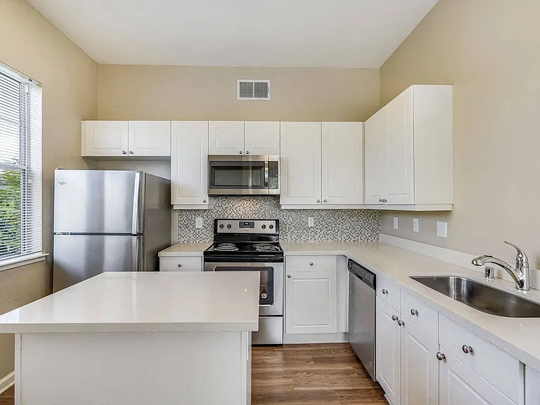 Enjoy quartz counters and stainless steel appliances in open-concept kitchens