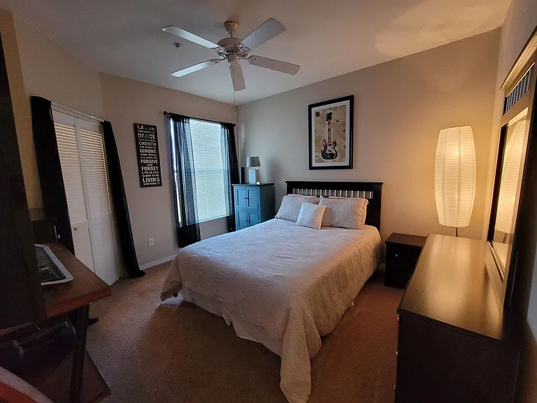 Roomy owners suite with queen sized bed + dresser & nightstand