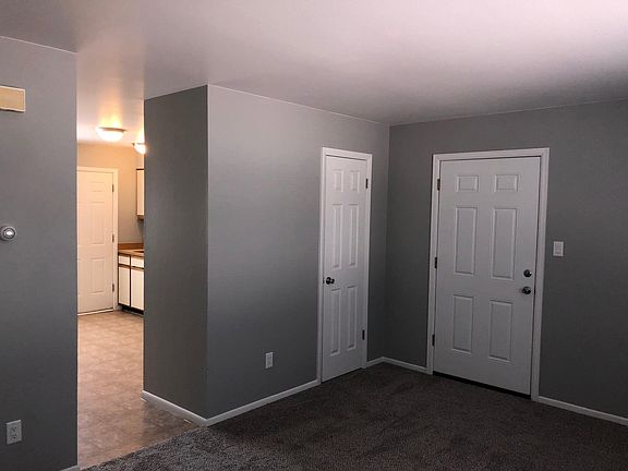 Living room with view of kitchen