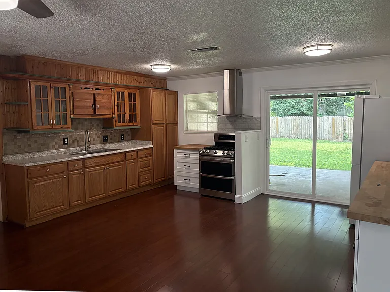 Fully renovated modern kitchen featuring premium stainless steel appliances, updated cabinetry with ample storage, and stylish contemporary finishes. Perfect for home cooks and entertainers alike.