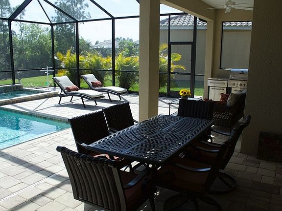 pool/dining area with summer kitchen