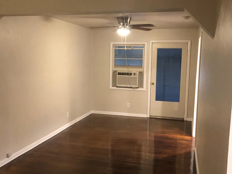 Dinning area, new ceiling fan, refinished original wooden floor and fresh paint.