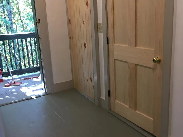 Main entrance hall with furnace and laundry closets