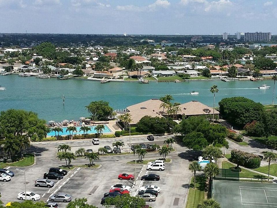 High view of pool, clubhouse and tennis courts