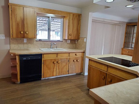 Kitchen sink window provides view out to the back yard. Dishwasher included.